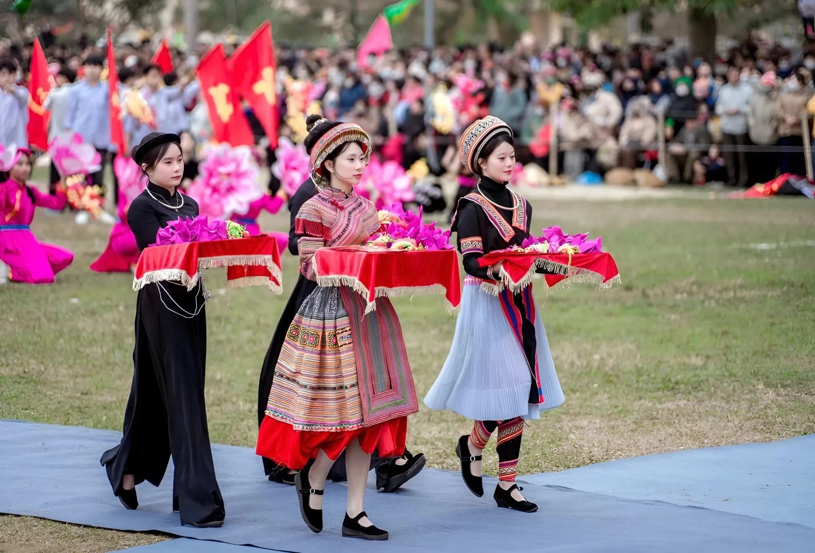 Young girls from Lam Binh in traditional costumes attend the Long Tong Festival.