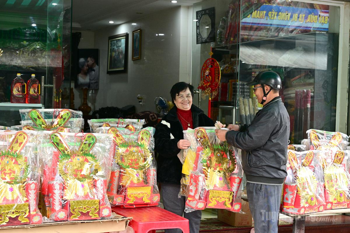 Shops selling votive paper offerings are crowded at this time.