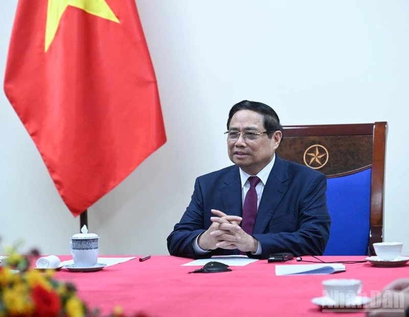Vietnamese Prime Minister Pham Minh Chinh at the phone talks with his Algerian counterpart Sifi Ghrieb on March 18. (Photo: Tran Hai)