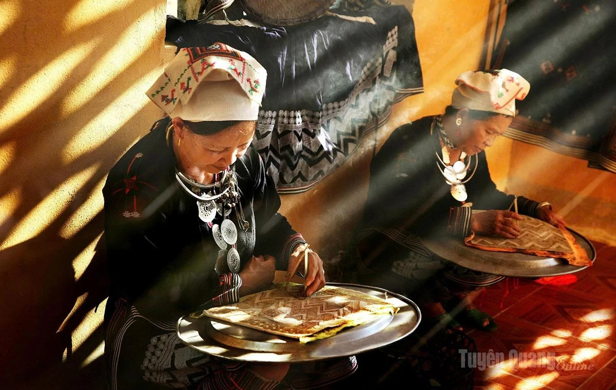 The distinctive traditional craft of wax-resist embroidery.