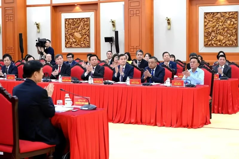 Party and State leaders, along with delegates, attend the working session.