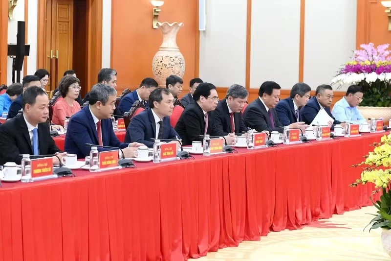 Party and State leaders, along with delegates, attend the working session.
