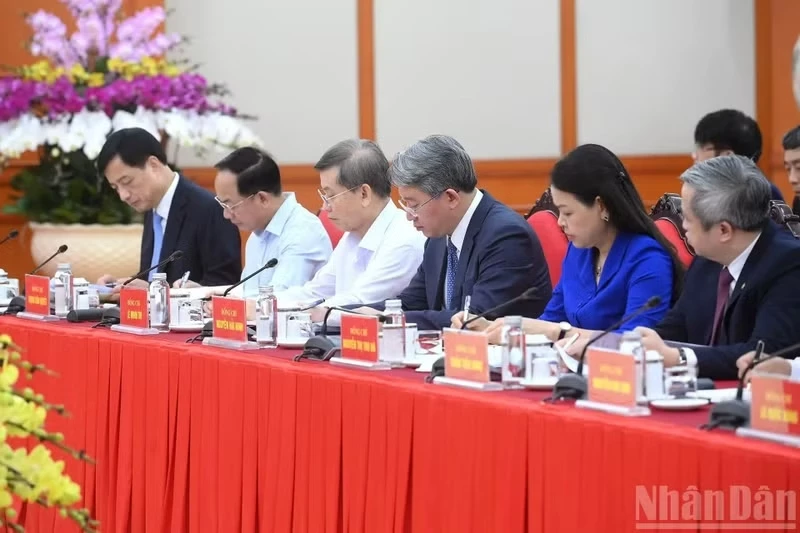 Party and State leaders, along with delegates, attend the working session.