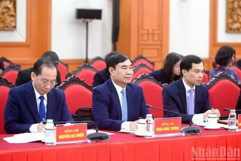 Delegates attend the working session.