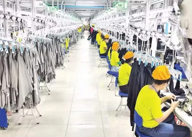 Garment production for export at a wholly foreign-owned Chinese company located in the Dong Nam Industrial Park, Binh My Commune, Ho Chi Minh City. (Photo: NDO)