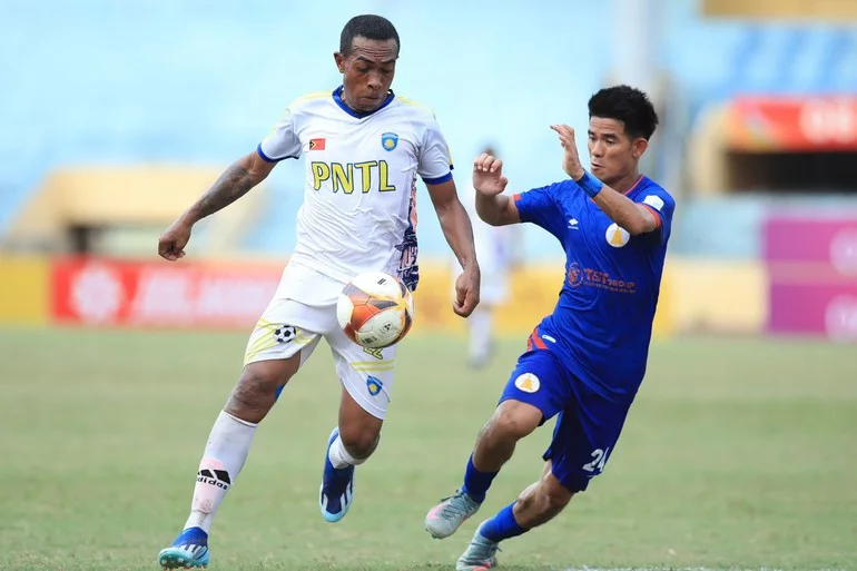 Timor-Leste (in white) pressing forward in attack.