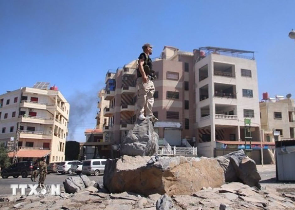 Các lực lượng an ninh Syria tại thành phố Sweida ngày 15/7/2025. (Ảnh: THX/TTXVN)