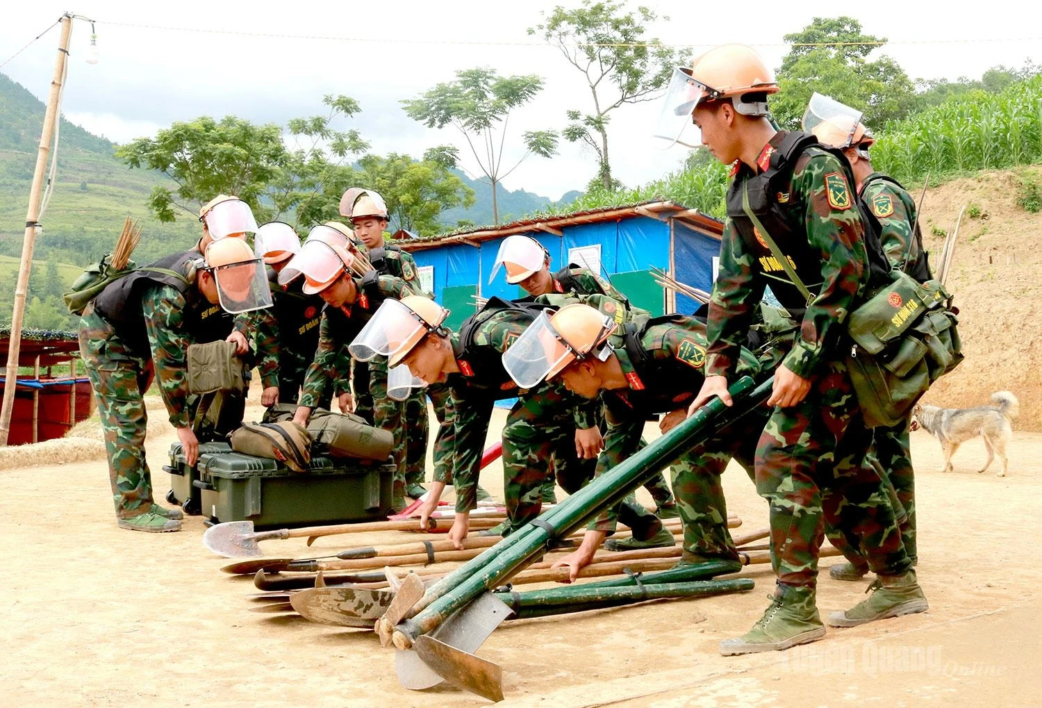Officers and soldiers inspect and prepare all necessary vehicles, equipment, and specialized tools for mine and unexploded ordnance clearance.