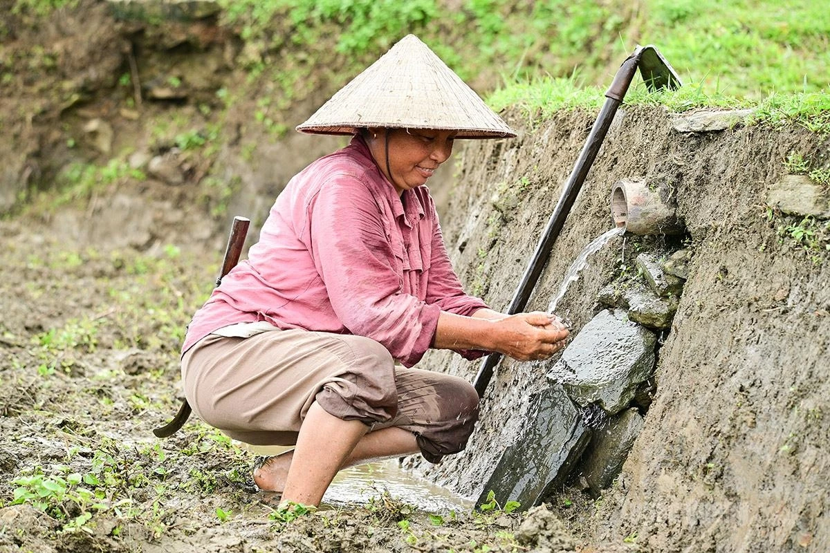 The hands of Hong Thais farmers transform rocky mountain slopes into a breathtaking ink-wash landscape.