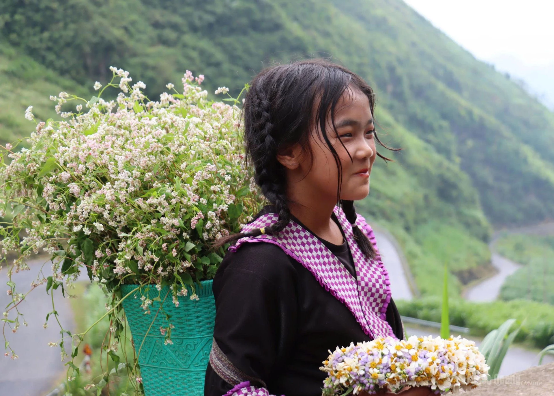 A H’mong child in Pho Bang commune beams like the spring of the mountains.