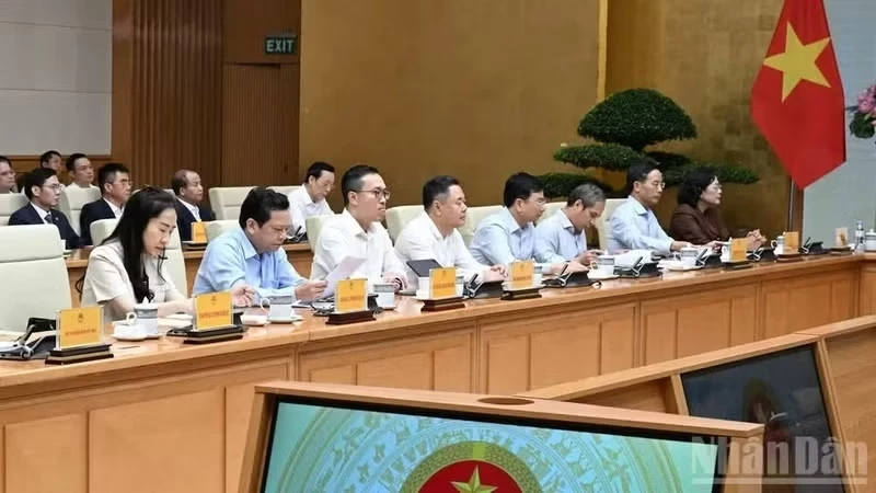 Delegates attend the meeting. (Photo: Tran Hai)