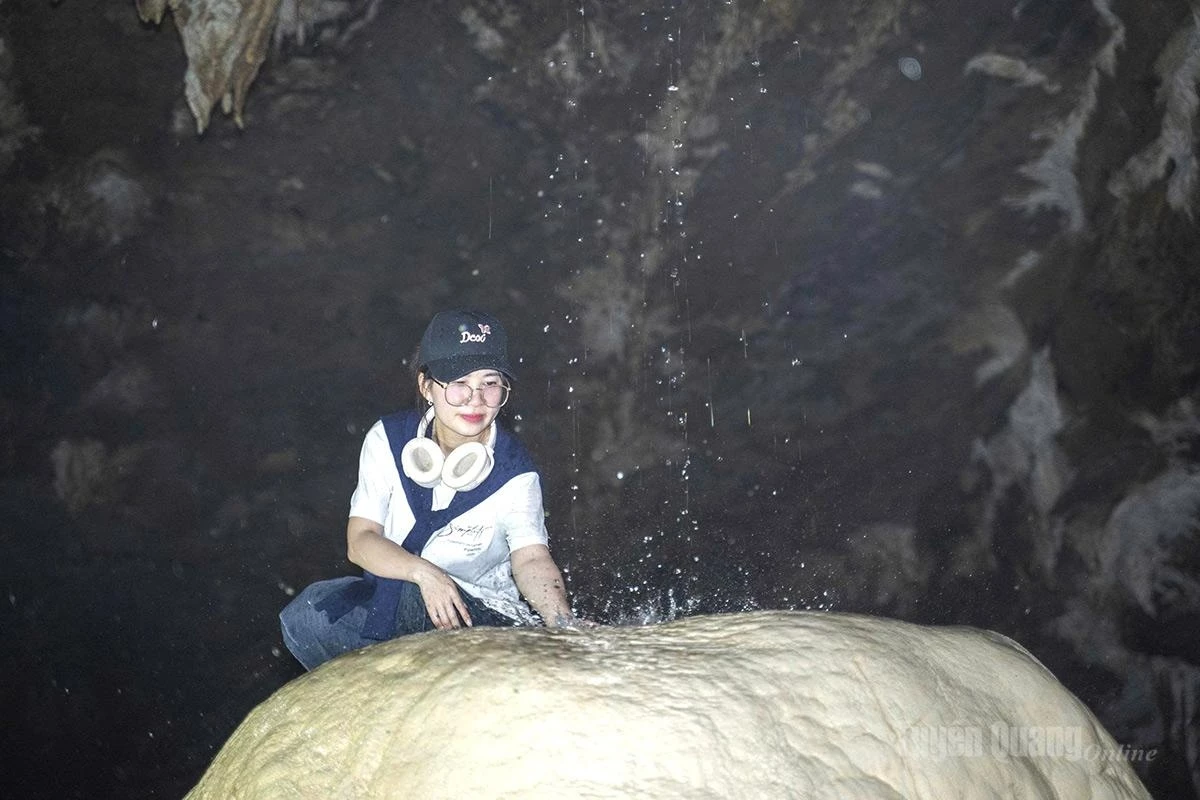 Drops of water trickling down the rock walls add to the cave’s mesmerizing beauty.