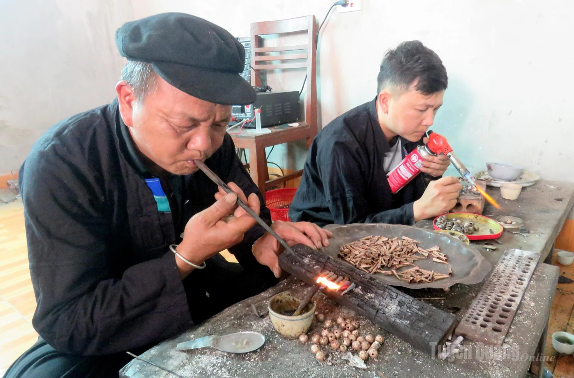 Father and son, Lu Van Kim and Lu Van Nghiem, work together during the firing process, which requires great precision to ensure the jewelry achieves both durability and an attractive finish.