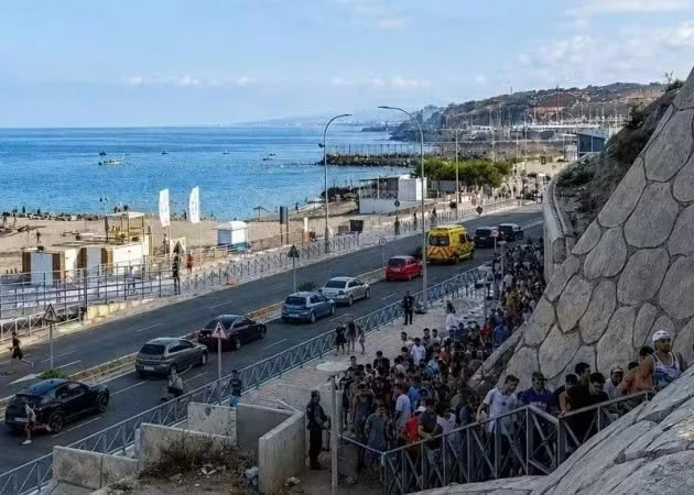 Migrants illegally cross the border into Ceuta, a Spanish territory in North Africa, on July 30, 2026. (Photo: Xinhua)