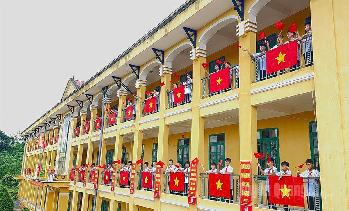 The red flag with a golden star fluttered brightly at Vinh Quang Secondary School in Kim Binh commune.