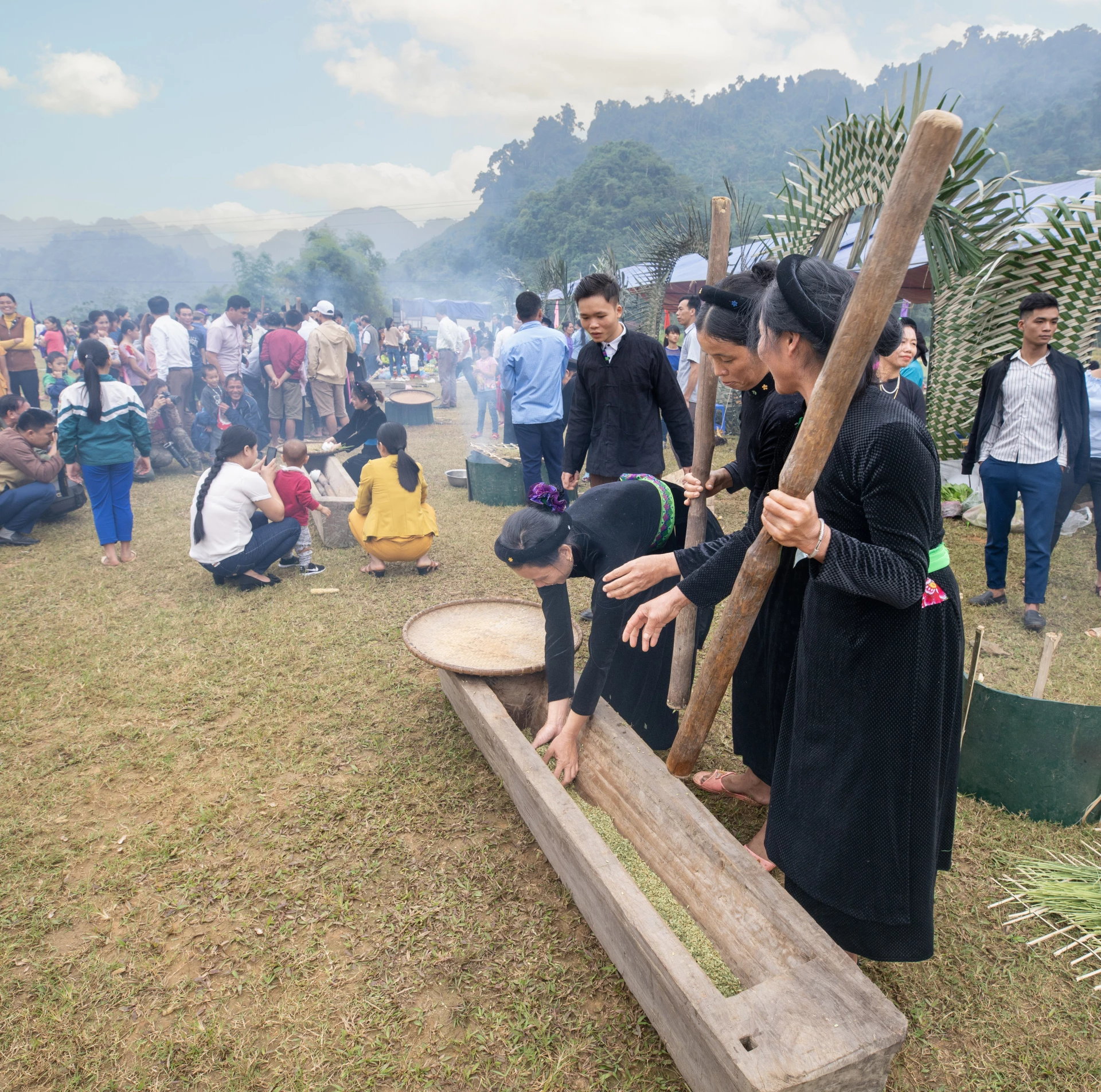 Tay people in Lam Binh commune pounding green rice flakes.