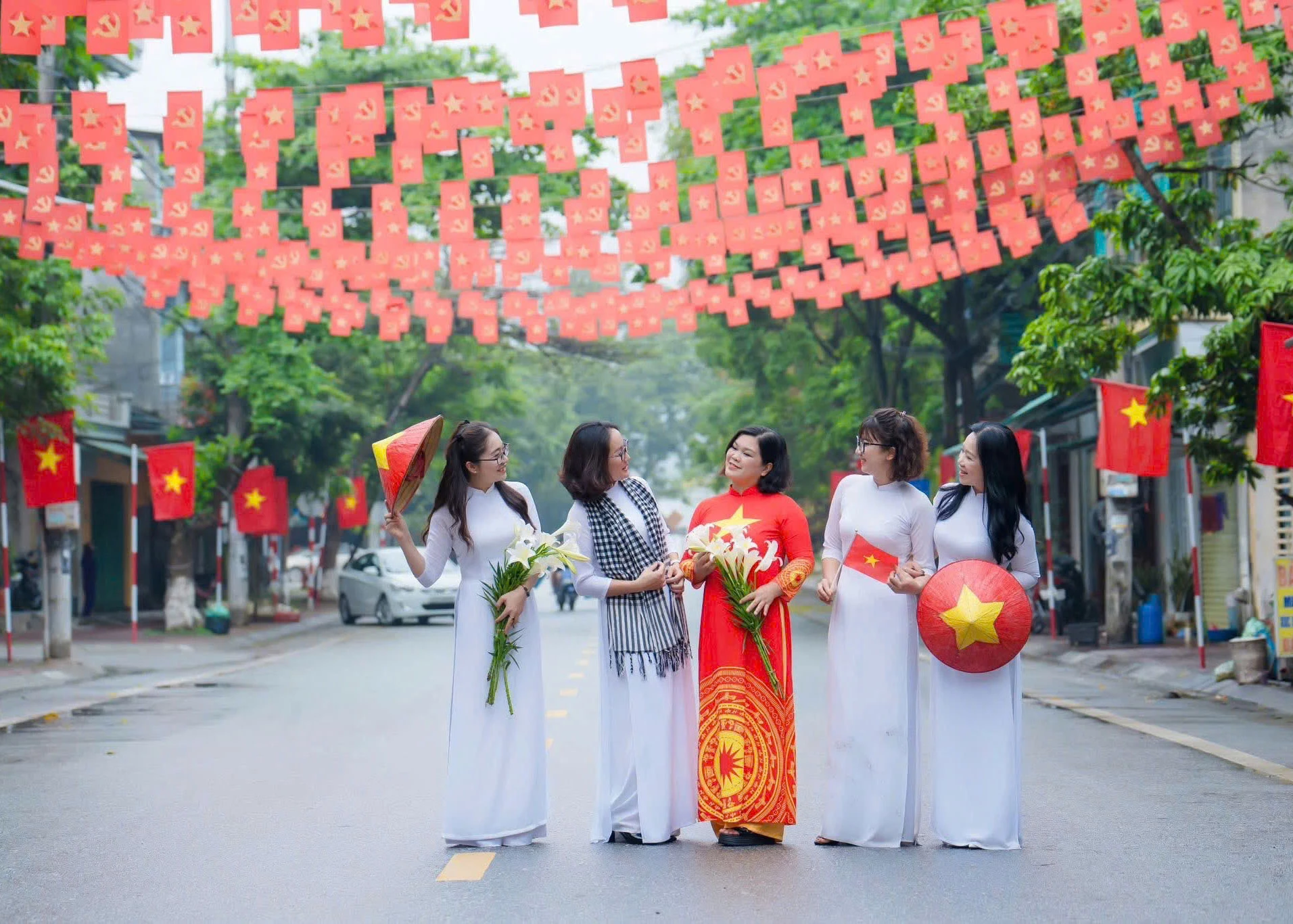 Many residents flocked to check in along flower-lined streets, which were draped in red flags throughout Tuyen Quang.