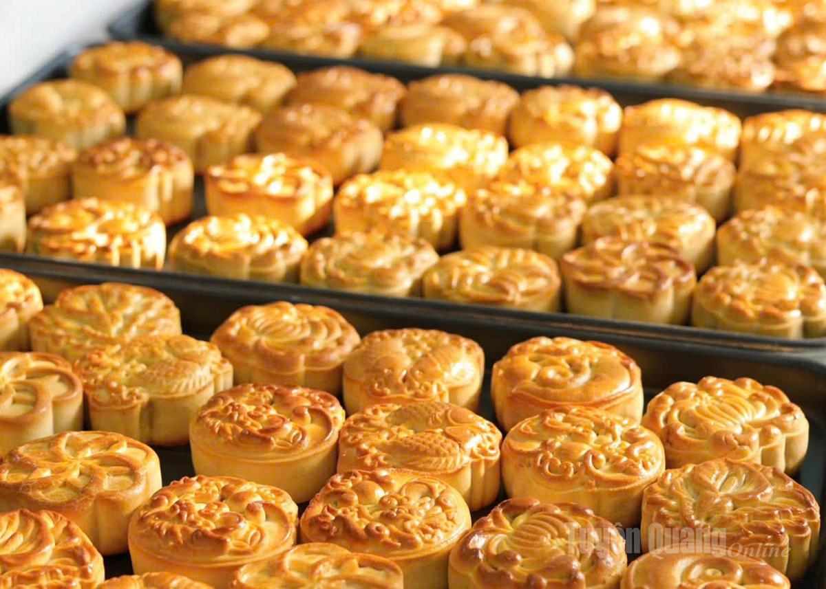 From the oven, each batch of mooncakes emerges hot and golden, spreading a tempting aroma throughout the room.