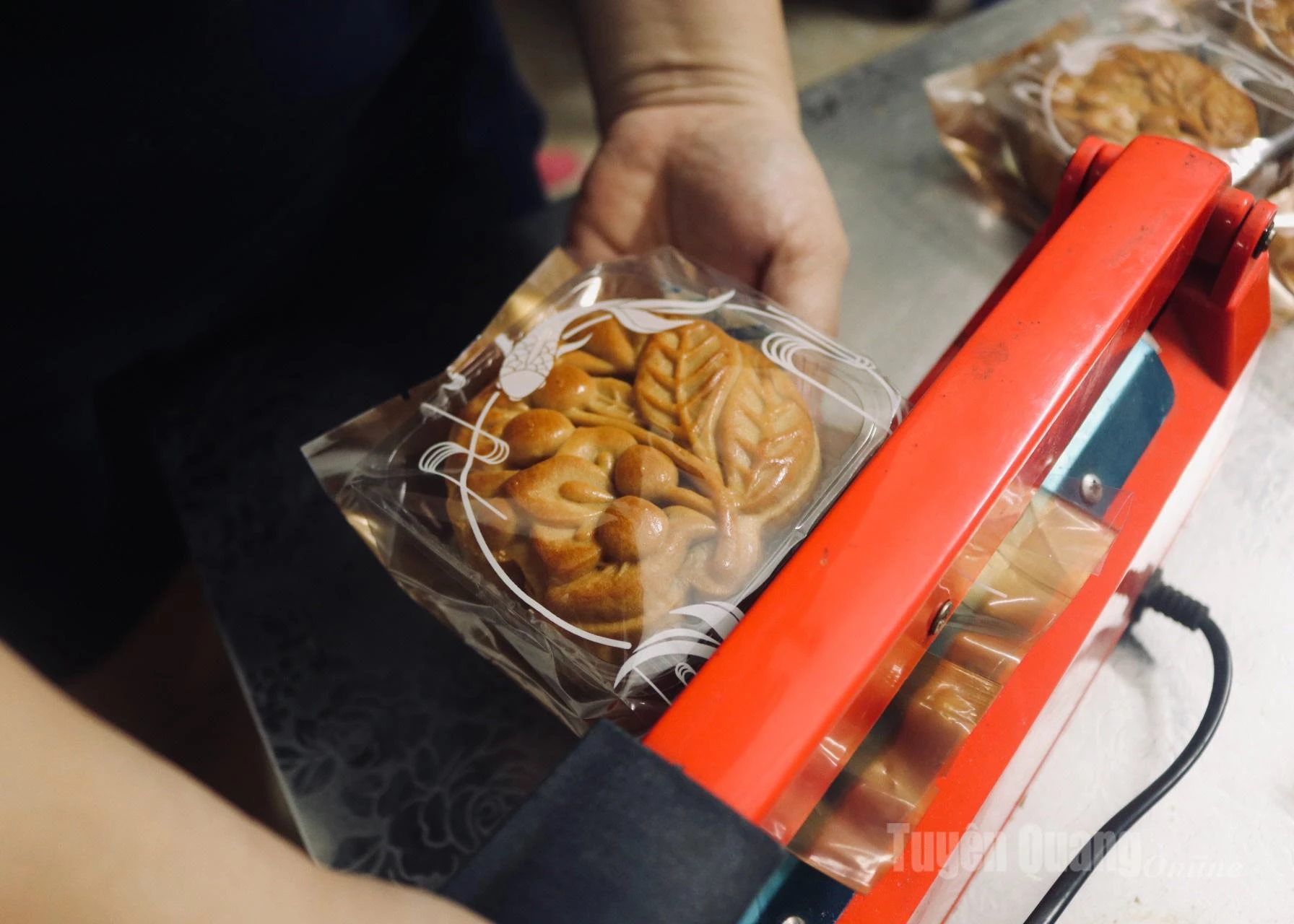 After all the steps, the final stage is packaging. Each cake is carefully placed in an attractive wrapping before reaching customers.