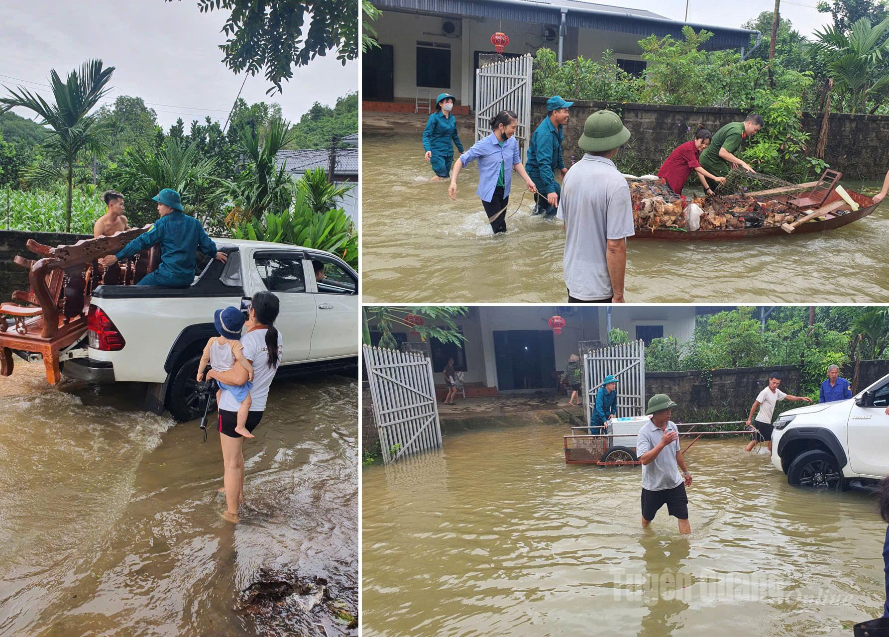 Lực lượng chức năng, người dân hỗ trợ giúp người vùng xung yếu của Mỹ Lâm đến nơi an toàn. Ảnh: Đoàn Thư