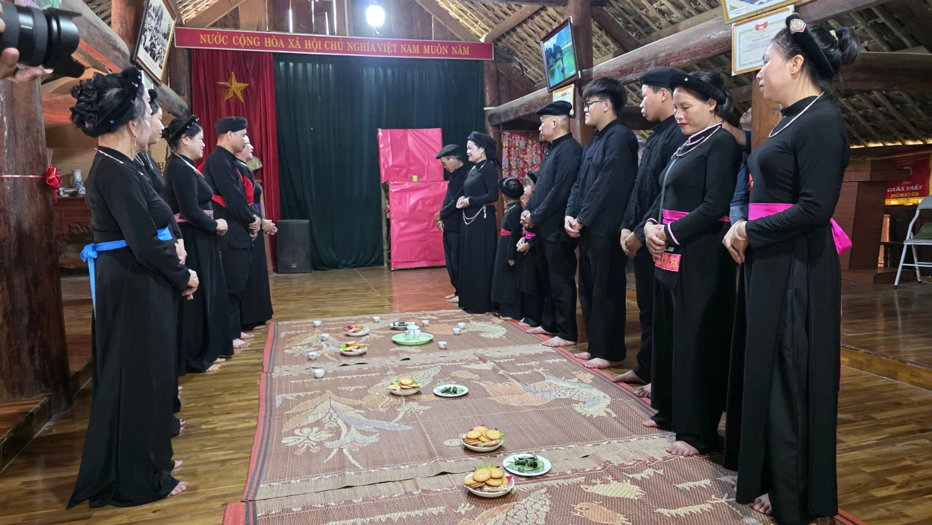 Inside the traditional stilt house, representatives of the groom’s and bride’s families communicate with each other through antiphonal singing.