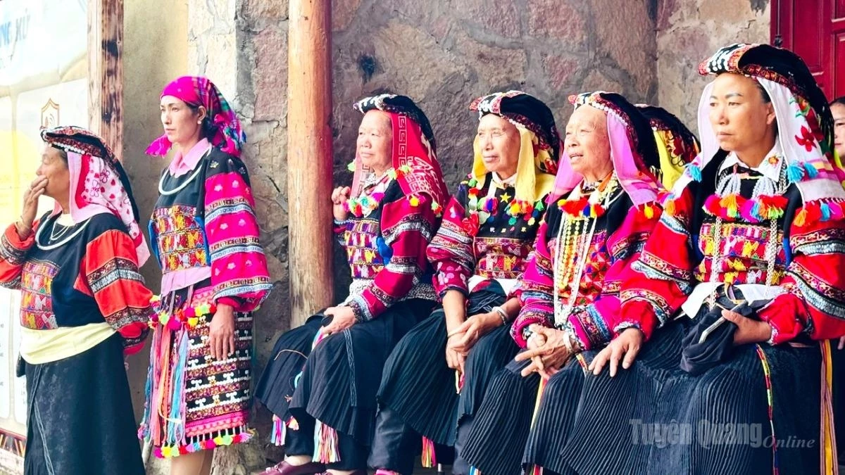 Traditional costumes add to the distinctive beauty of Lo Lo women during the Ancestral Worship Ceremony.