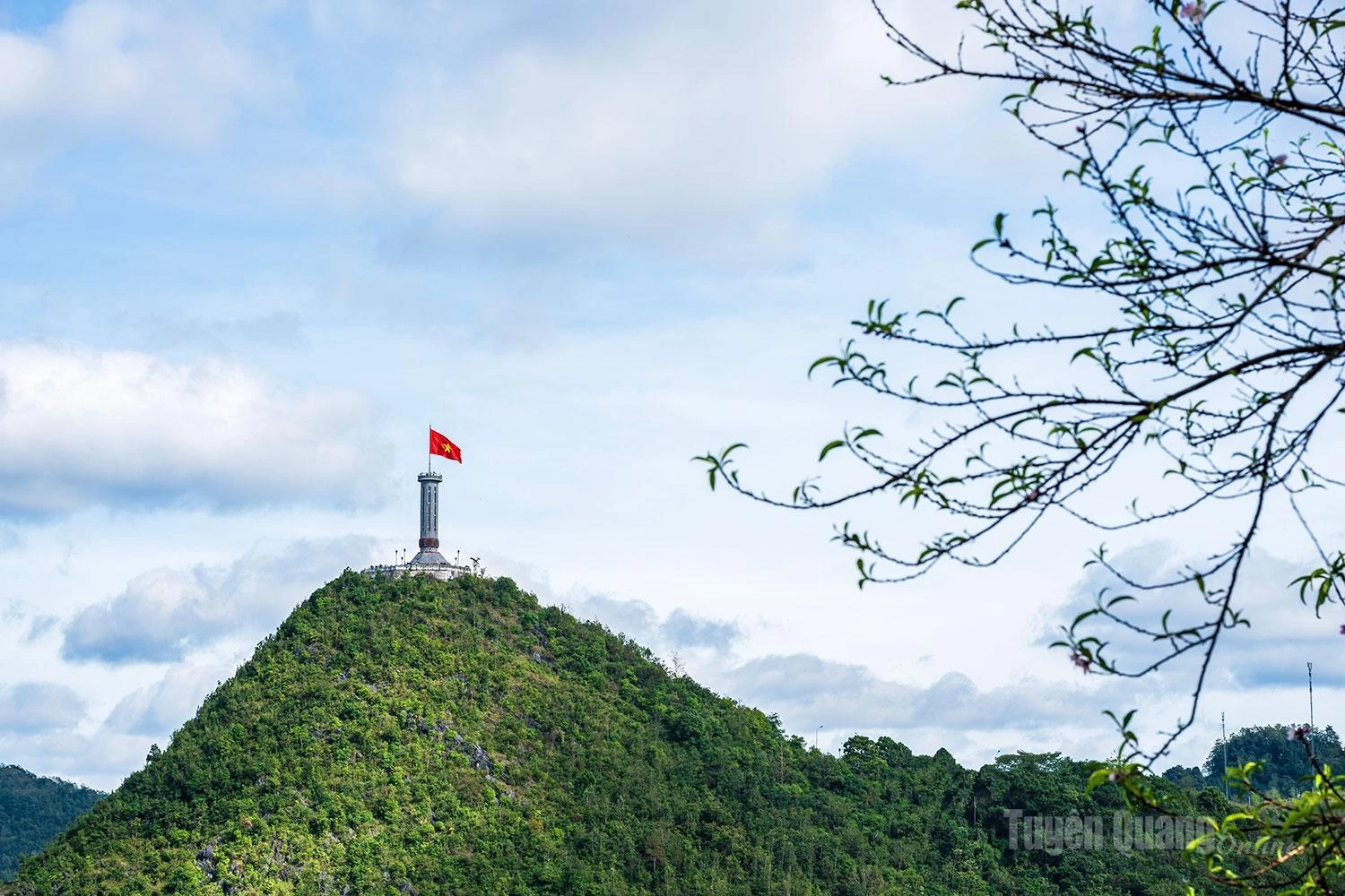 The national flag flies proudly atop the Lung Cu National Flag Tower.
