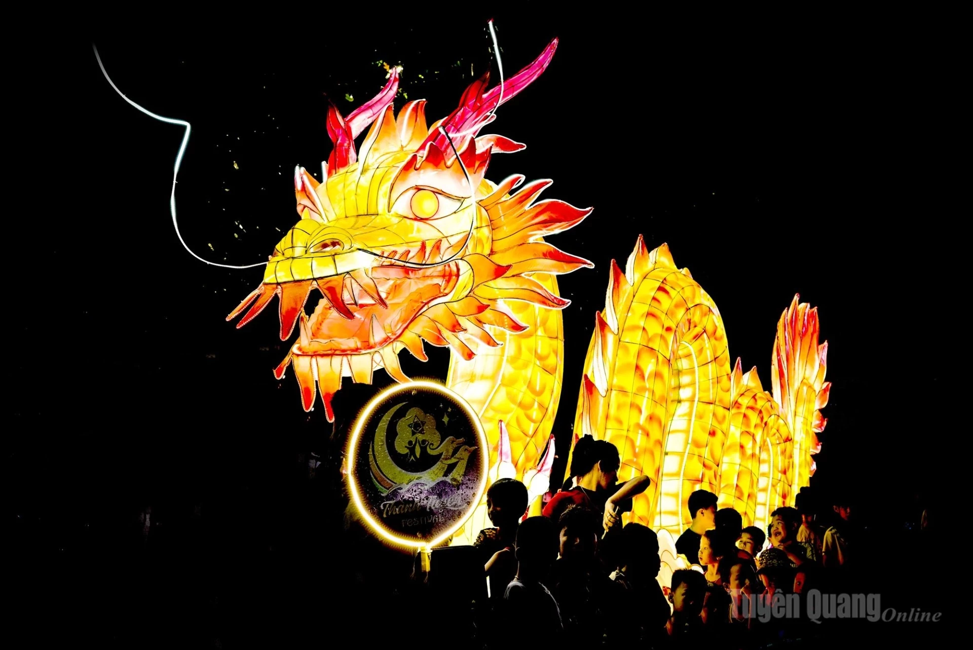 A dragon model appears at the festival.