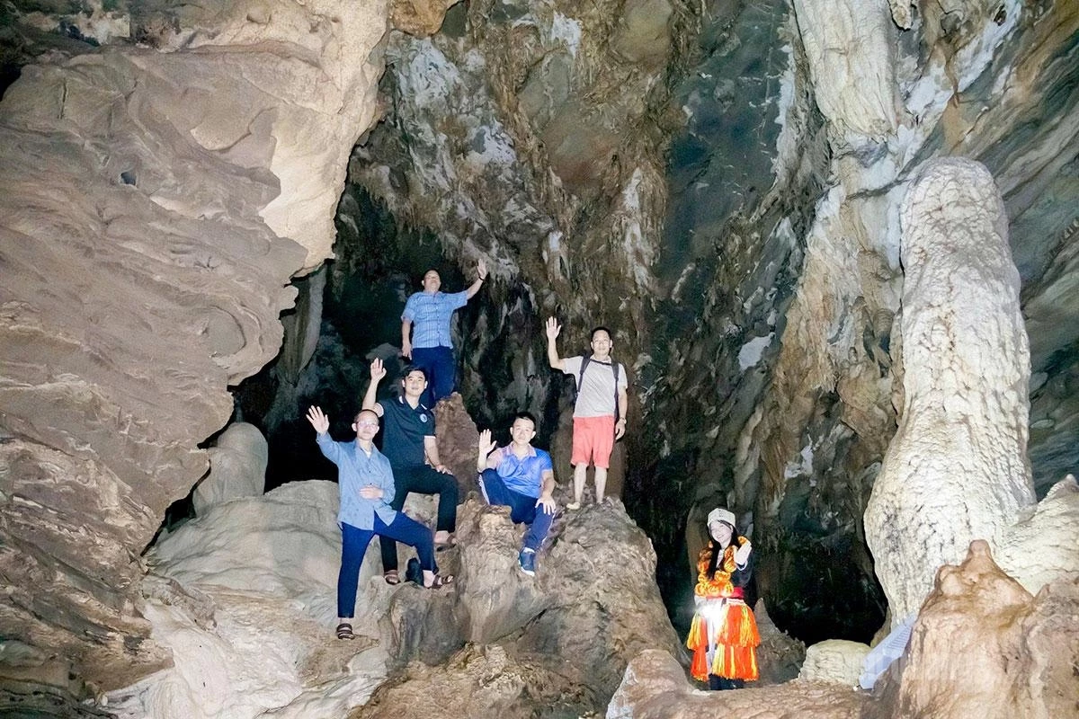 Visitors explore Thung Cave.