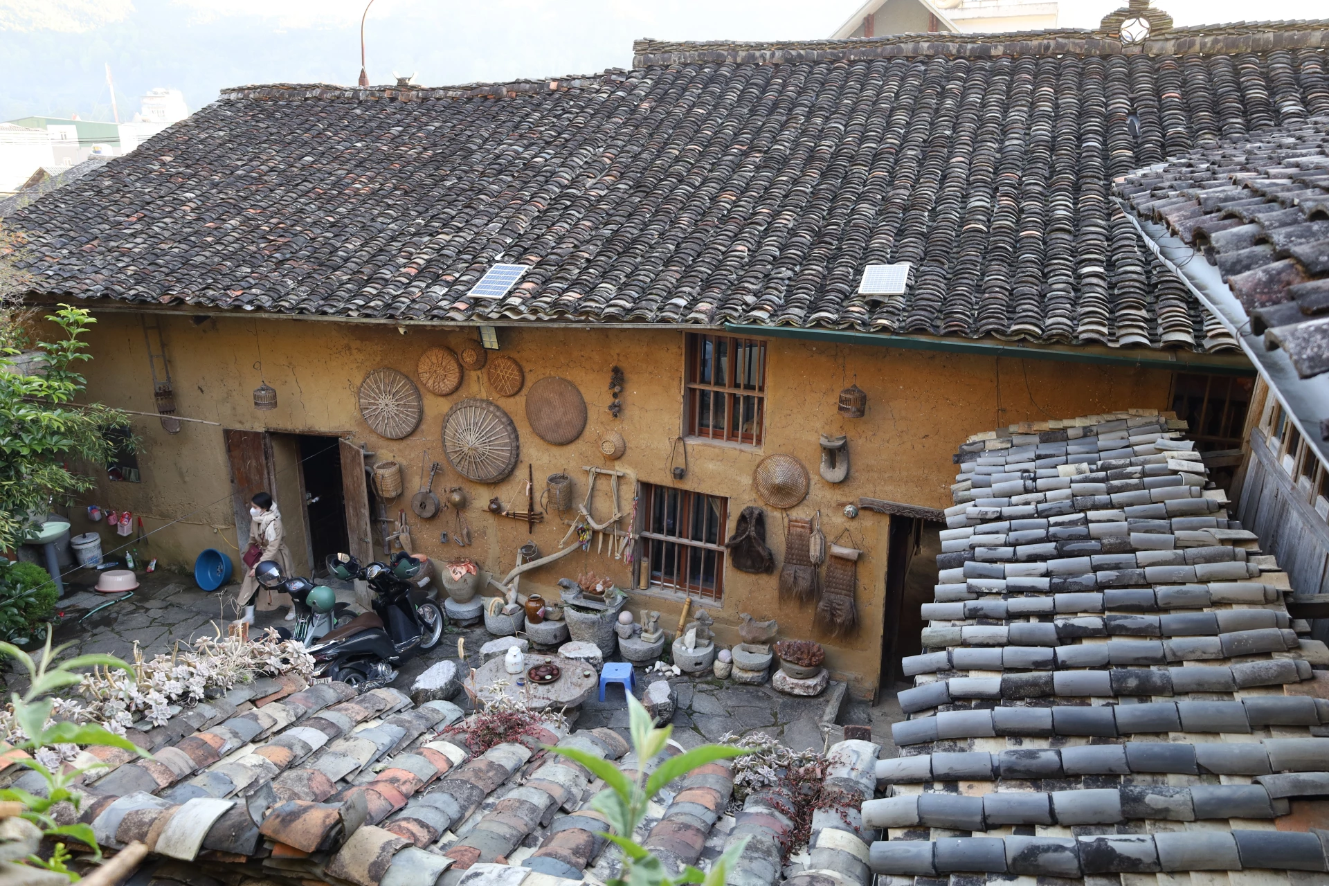 Moss-covered walls, yin-yang tiled roofs and dark brown wooden window frames have become distinctive symbols of Dong Van Old Quarter.