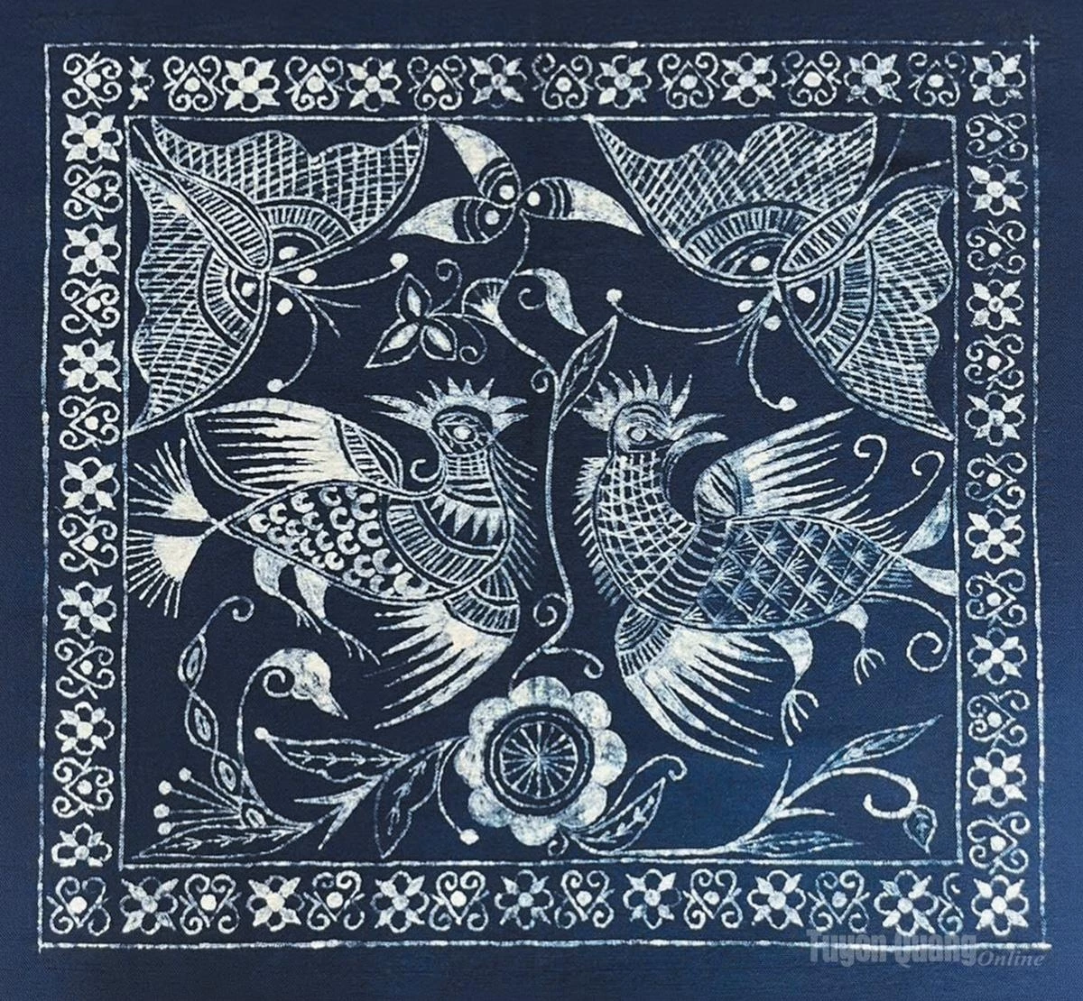 A beeswax painting on indigo-dyed fabric by Thuy Trang.