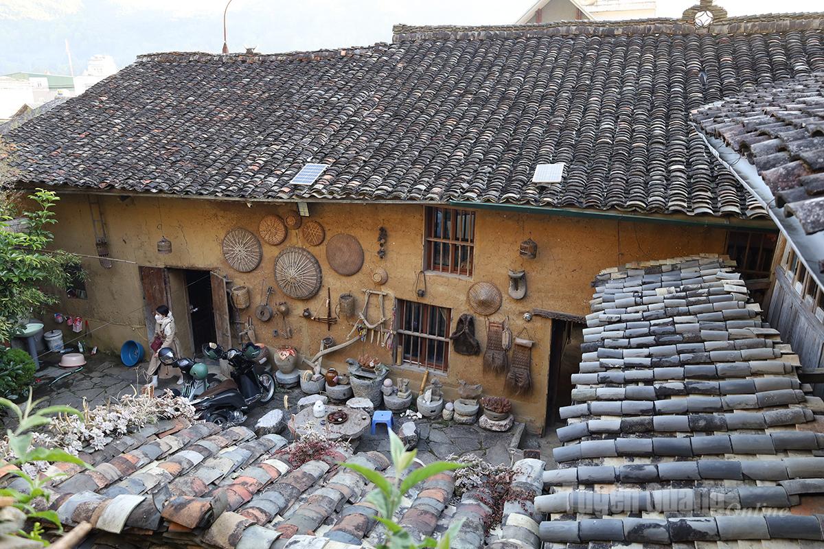 The architecture of the houses in the Old Quarter shares common features: earthen walls; intricately carved stone or wooden beams and columns; and yin-yang roof tiles - a distinctive roofing style of highland ethnic groups.