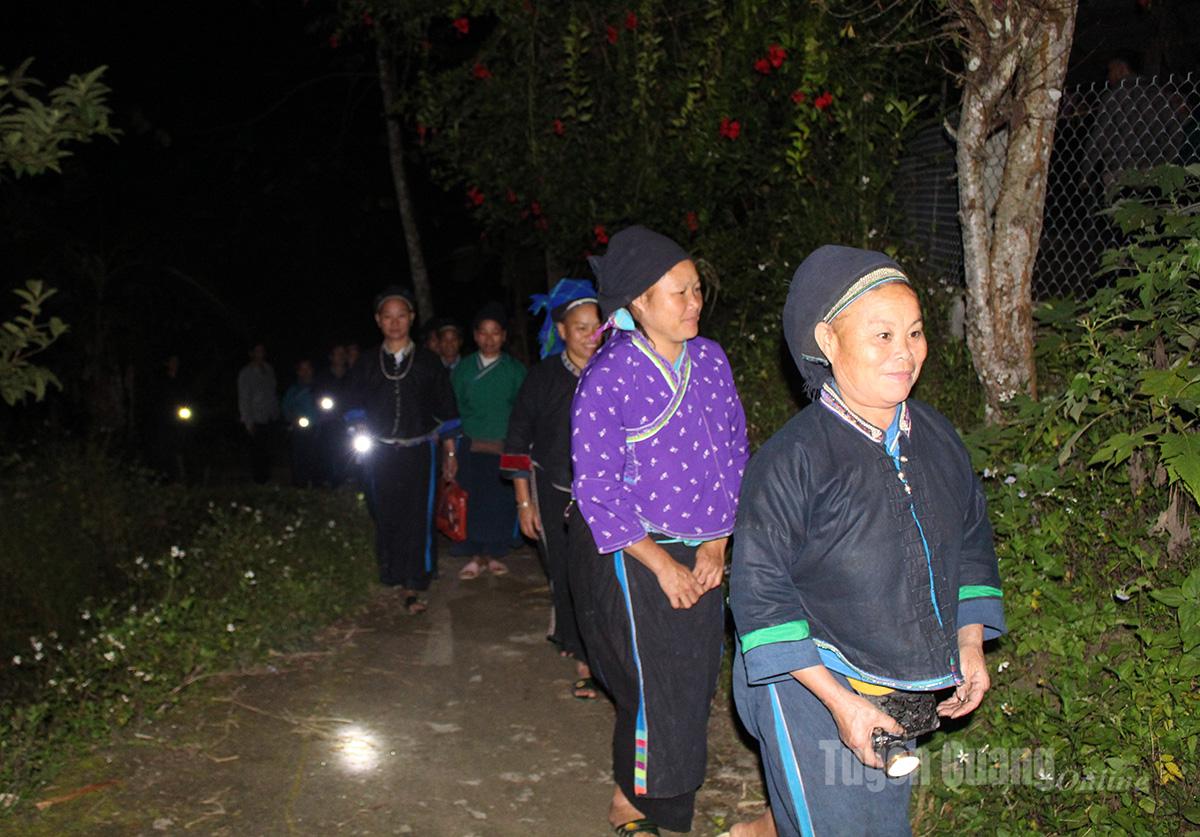 With flashlights, people in Coc Mui Ha Village trek across rugged mountain paths to attend the class.