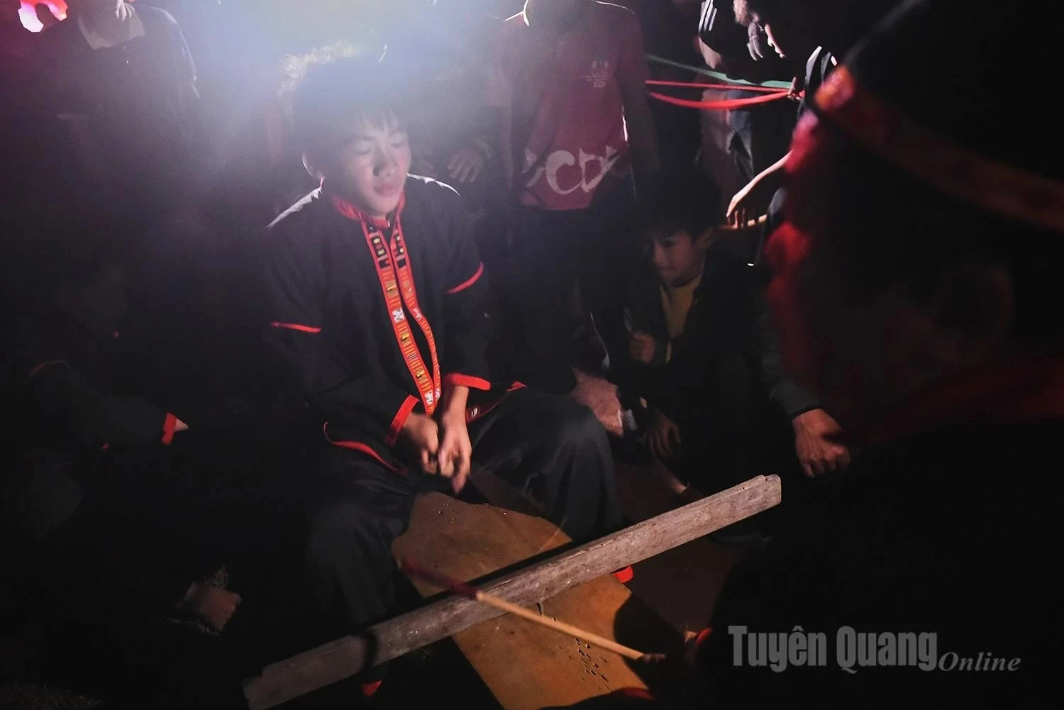 Some young men sit on ritual chairs, beating out rhythms for the next “energy transmission”.