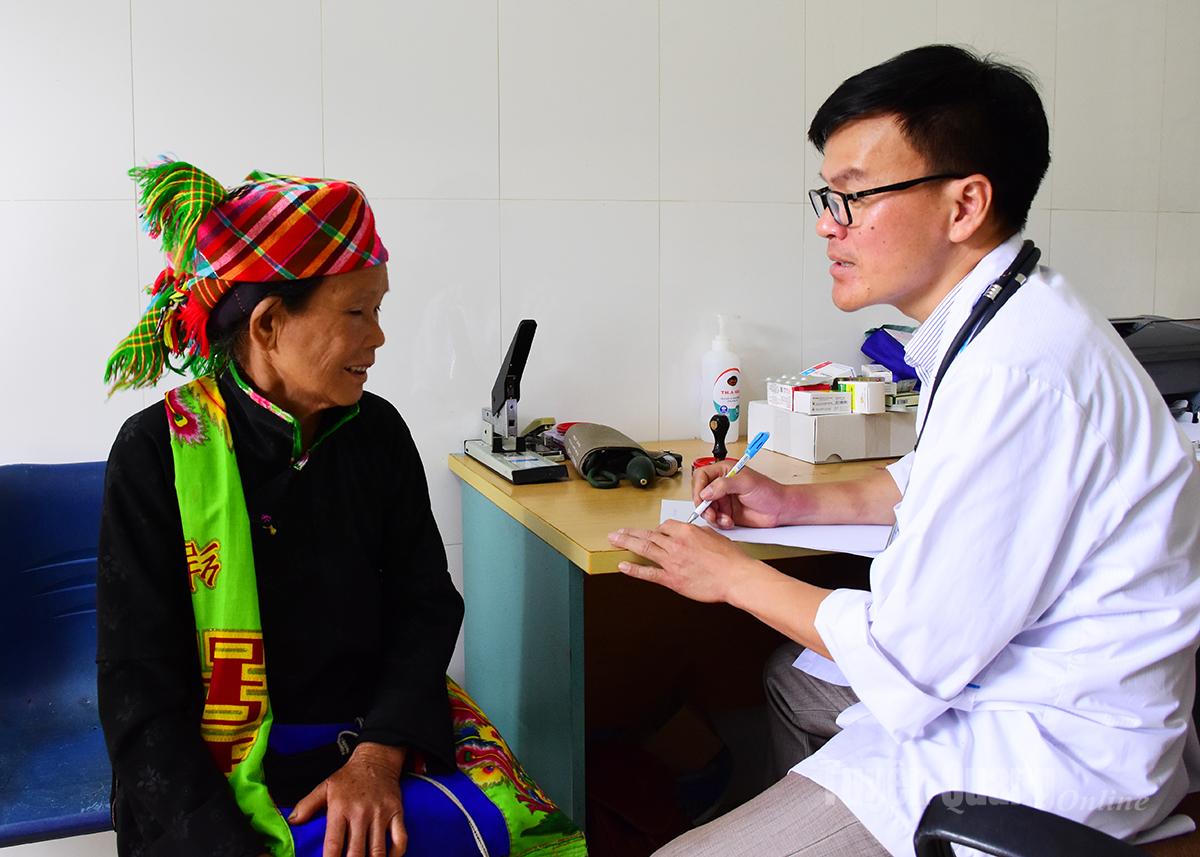 Medical staff at Son Vi Commune Health Station examine local people.