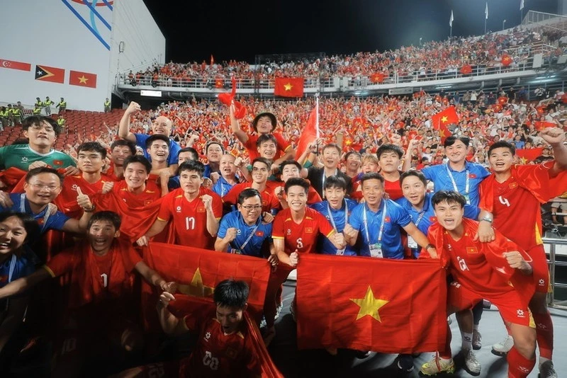 Viet Nam’s U22 players revel in their victory. (Photo: VNA)